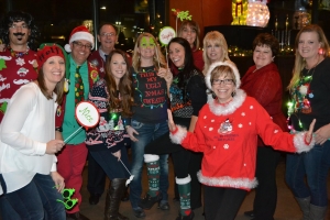 Members in holiday sweaters