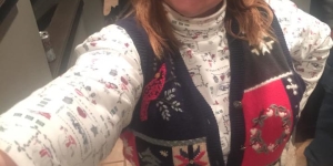 Member in holiday sweater