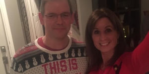 Two members in holiday sweaters