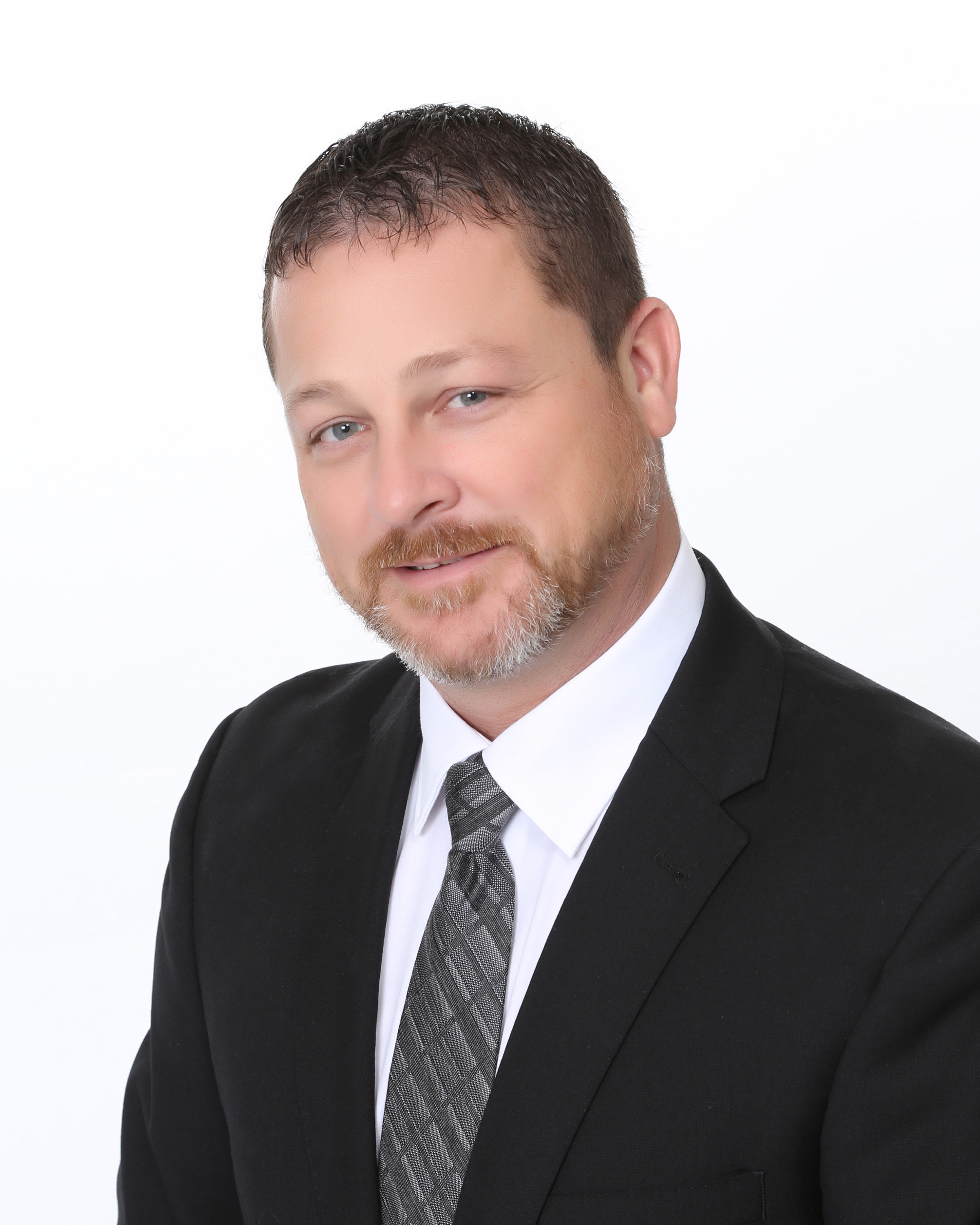 Brad Sanderson 2019 Man in suit and tie smiling