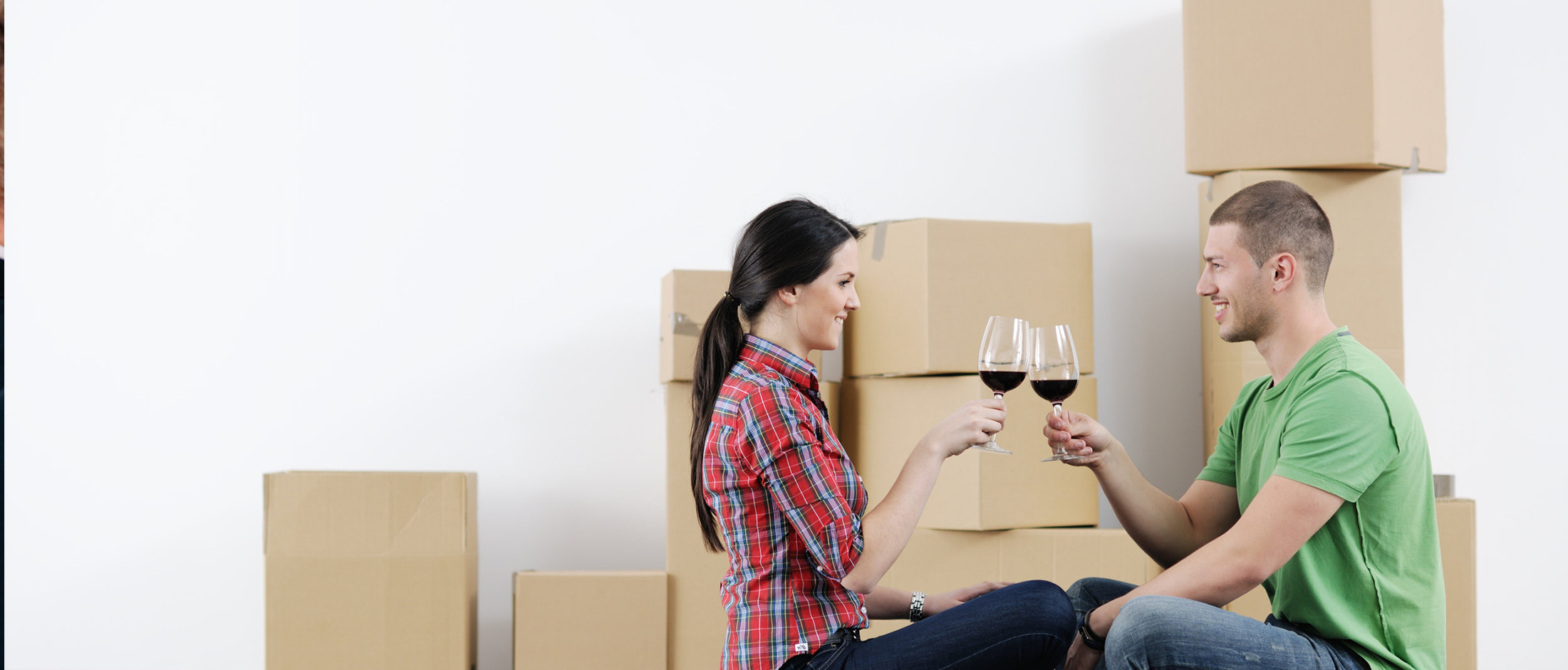 Couple with boxes in new home
