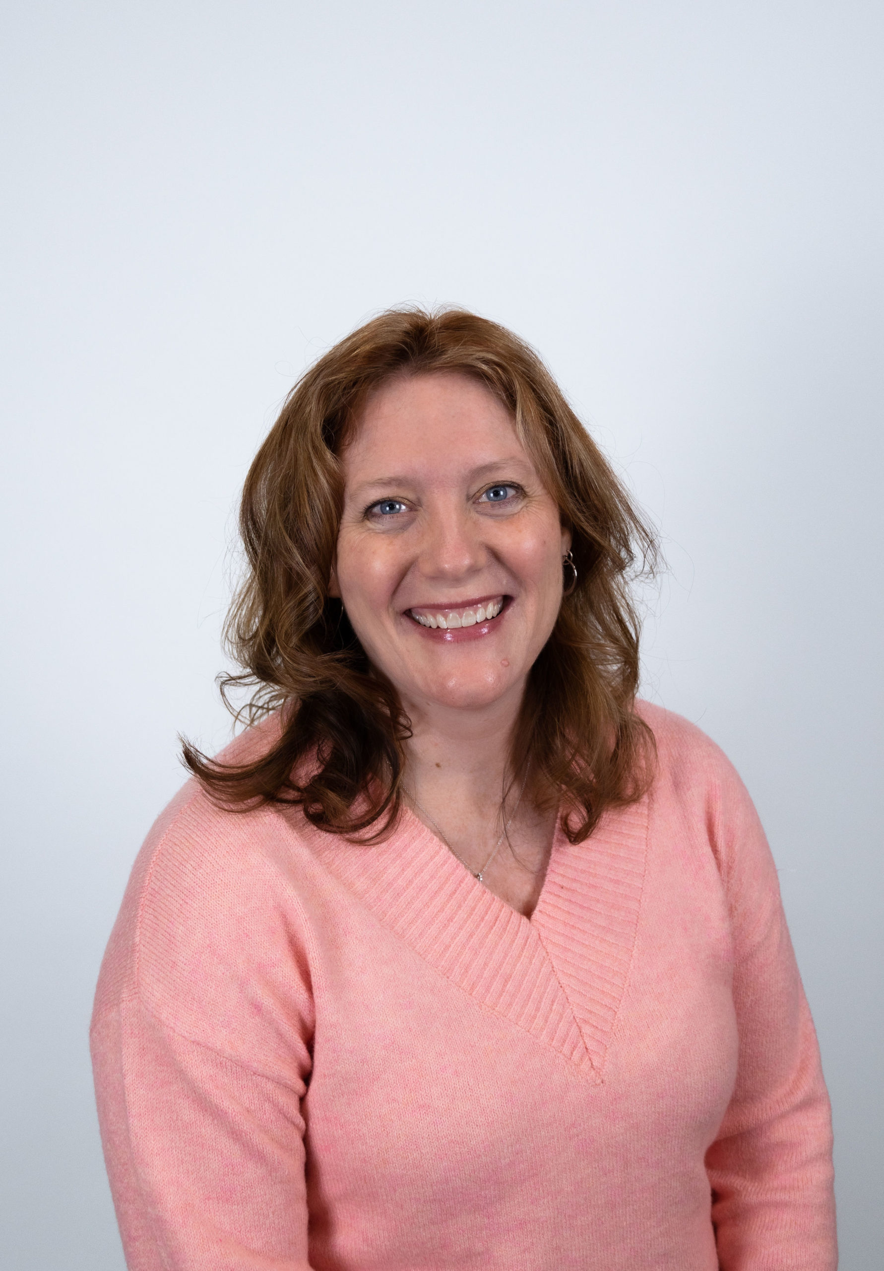 Christy Conrad 2022 Woman smiling in pink top