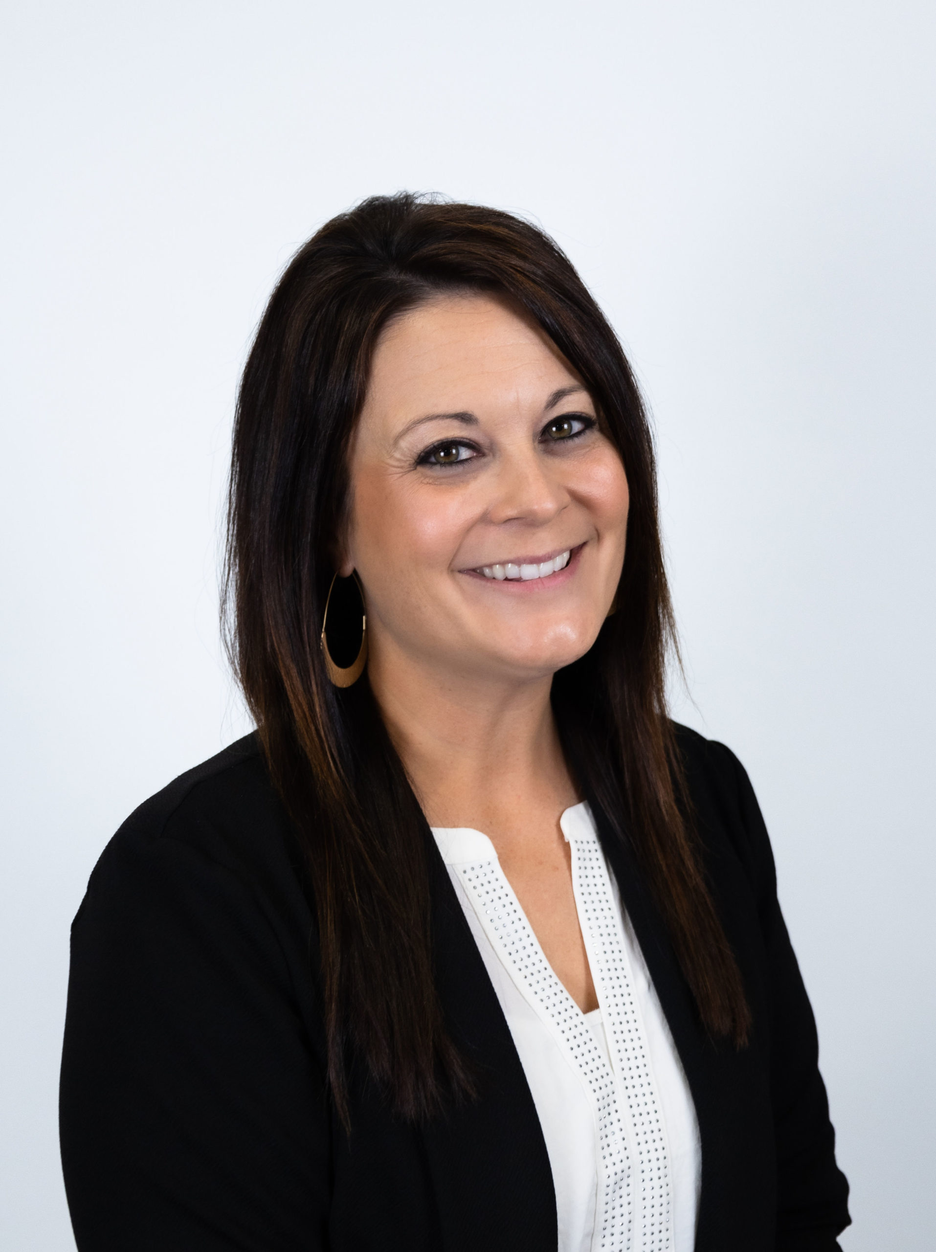 Woman smiling wearing black blazer jacket